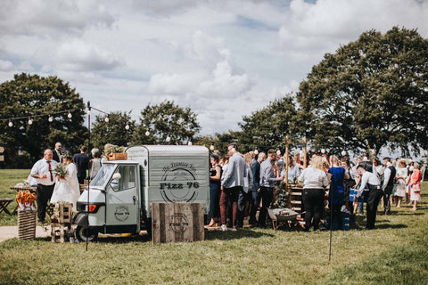 White Big Day Wedding Umbrella package sitting next to the Prosecco Van and Wedding Food  Truck at Abbi and Ash Rock my Wedding featured festival wedding