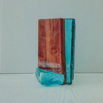 Coastal-themed decor combining natural wood with blue resin, evoking the image of ocean waves.
