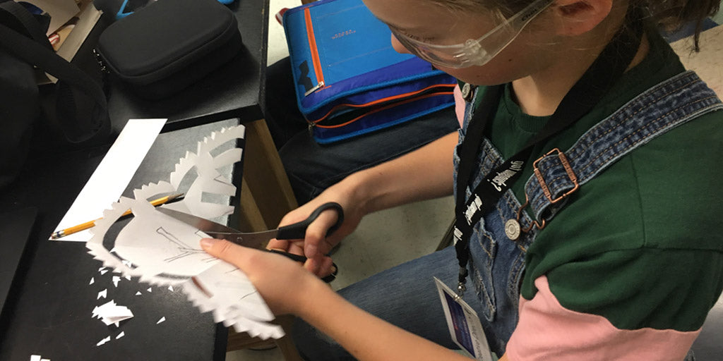 Student creating drone costume.