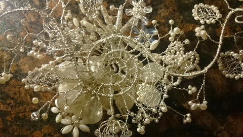 Back detail of a wedding jewelry Bespoke piece, a floral bridal headpiece made from sterling silver and pearls!