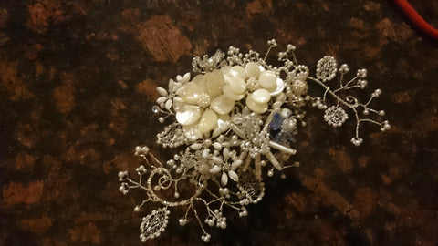 Front detail of a wedding jewelry Bespoke piece, a floral bridal headpiece made from sterling silver and pearls!