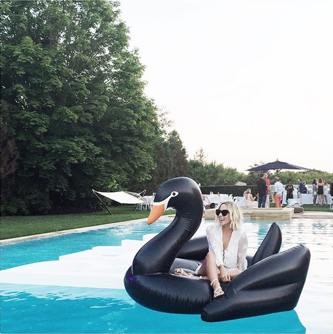 Jacey Duprie of Damsel in Dior on the FUNBOY Black Swan Pool Float
