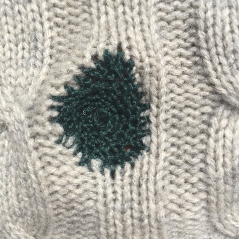 crochet mend close up visible mending