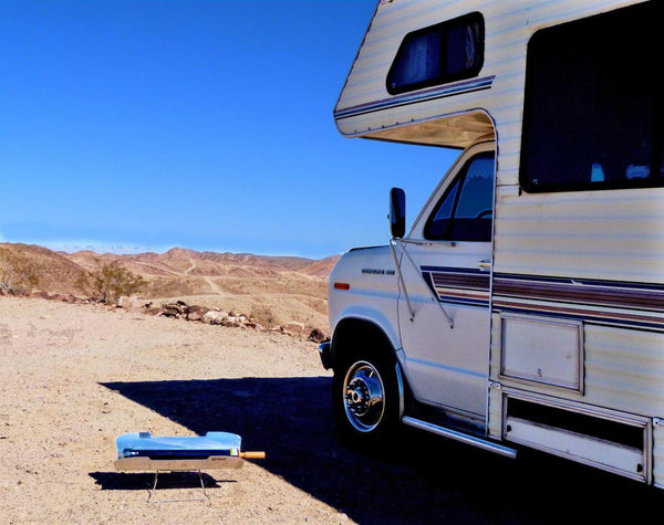 a parabolic dish solar cooker by an RV