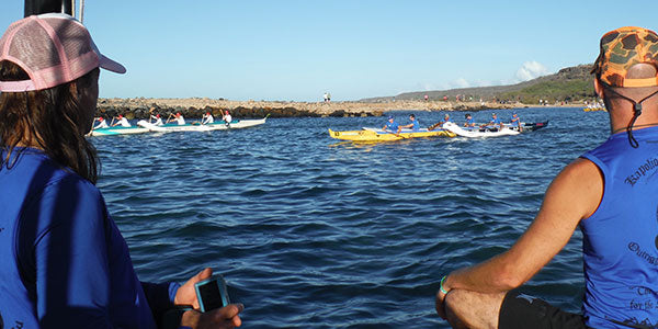 Canoes heading to race