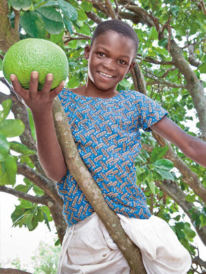 Barbra, age 11, likes to climb the trees and eat the fruit.
