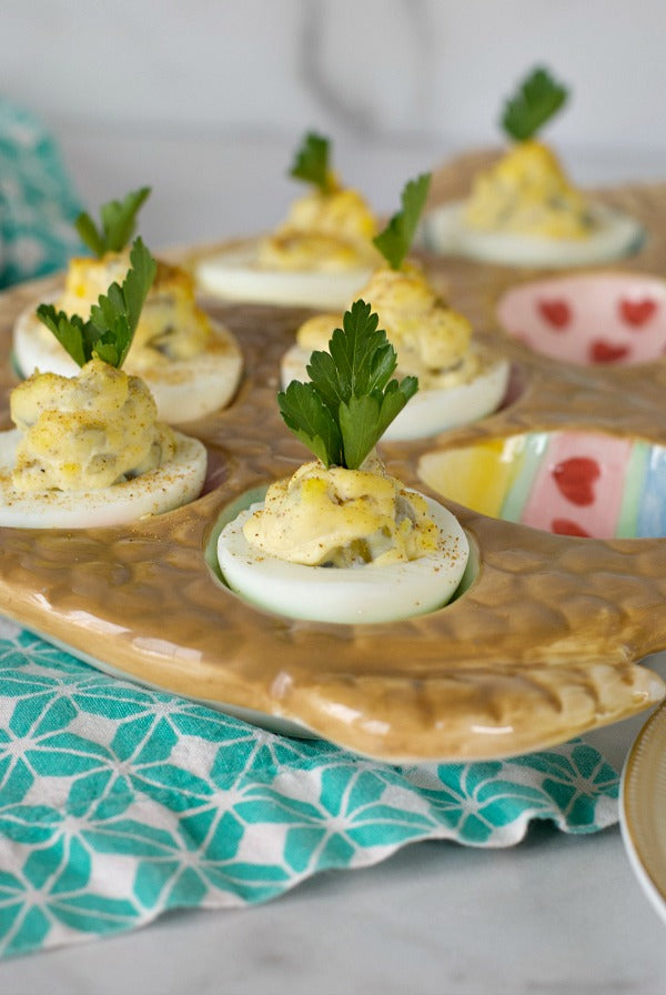 15 minute deviled eggs are a classic recipe that comes together in just minutes. Try these for Easter and springtime brunches or for a quick luncheon snack. #eggs #eggrecipes #deviledeggs #brunch #brunchrecipes