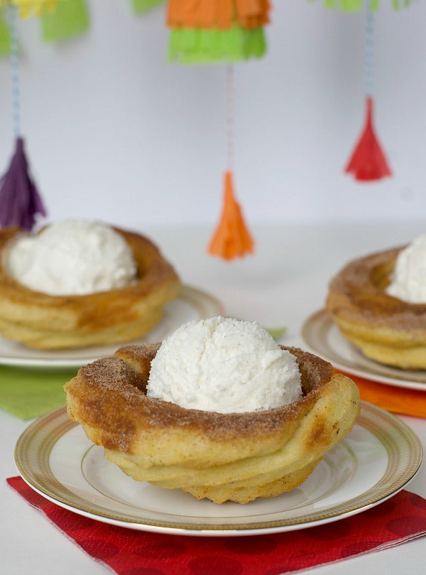Click through to see my baked churro ice cream bowls that are a perfect treat for Cinco De Mayo parties or any old time. Takes you back to Disney too! | SatsumaDesigns.com #churro #disney #cincodemayo