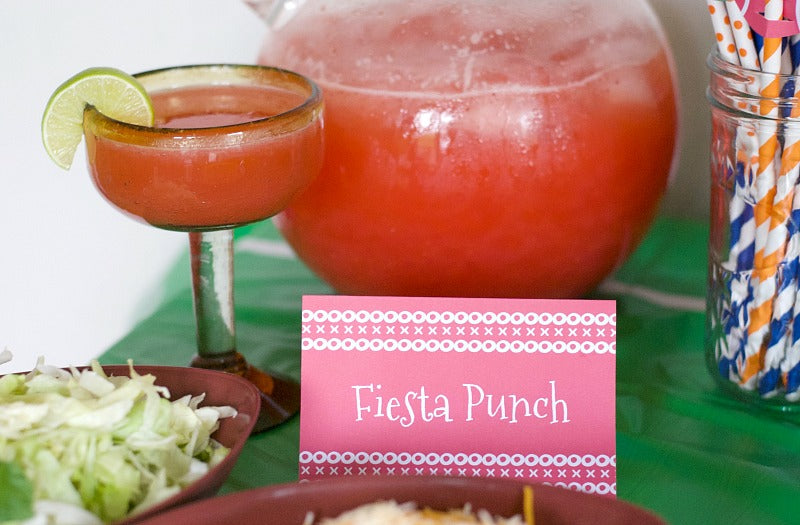 Football Fiesta Punch I start by blending frozen strawberries with a can of frozen lemon-lime juice. I add a bottle of sparkling water and garnish with lime wedges.   Bowl game fiesta party plan | How to host a Mexican fiesta | Host a taco bar | How to host a tostada bar | SatsumaDesignscom #college #football #fiesta