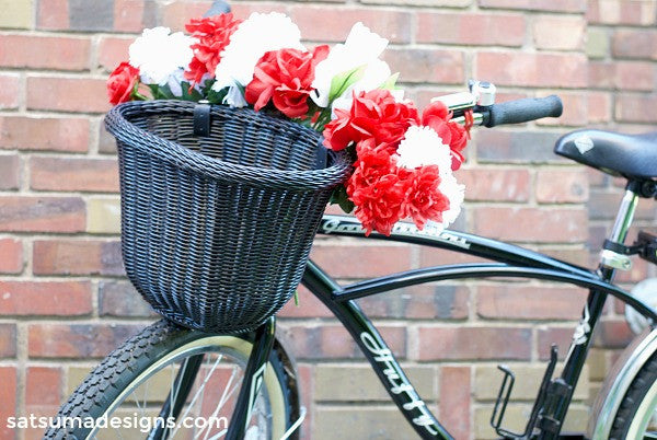 DIY Fourth of July Bike Flair. Add these easy and festive touches for a neighborhood bike ride this July 4th! #fourthofjuly #july4th #celebrate #bikeride #kids #summer #summerfun #summerparty #tassels #fireworks