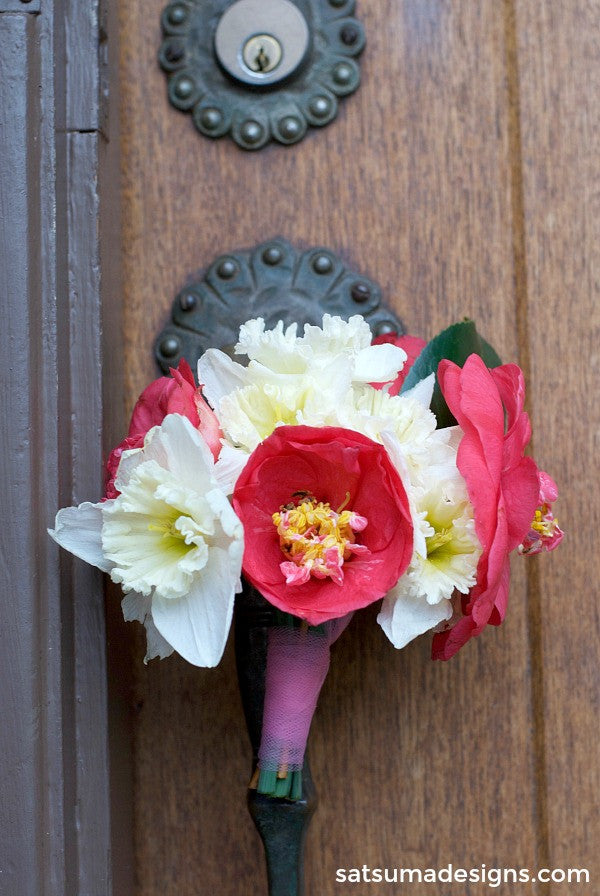 Bouquet of flowers on a door handle