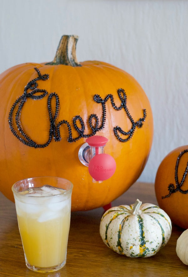 Click through to see how I made this fun pumpkin beverage dispenser for Halloween parties | SatsumaDesigns.com #party #Halloween