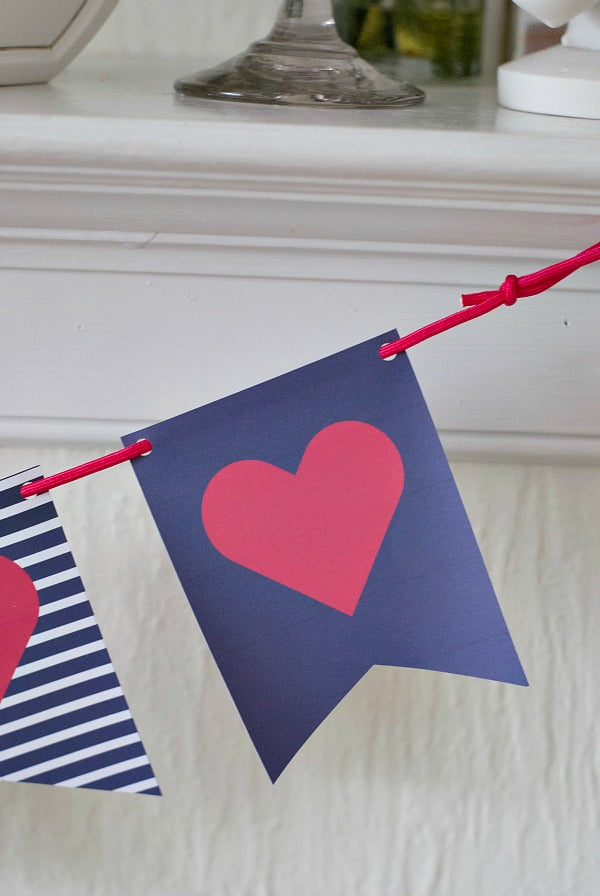 Navy and hot pink valentine banner for decorating. Easy printable in three styles for Valentine's day decor. #valentine #valentinesday #garland #banner #heart #love #printable #papercraft #satsumadesigns