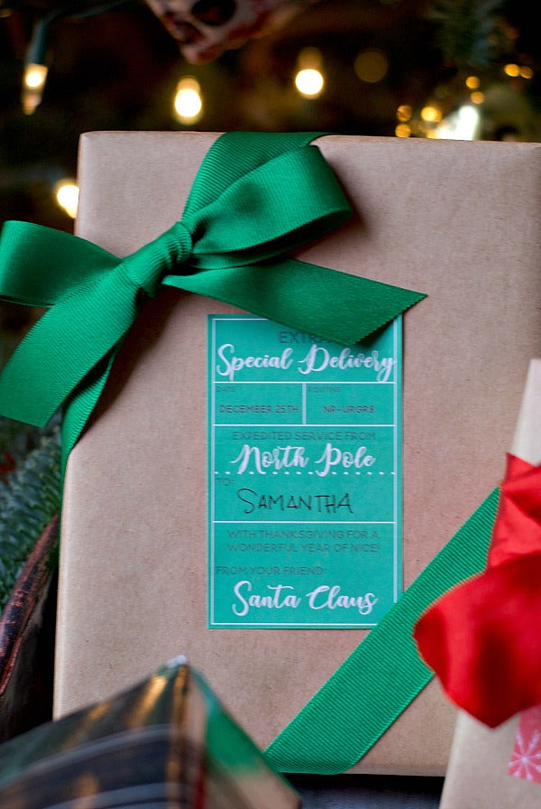 Santa's North Pole Delivery adhesive gift tags are a great solution for Christmas gift wrapping from the jolly old elf himself. This printable is easy to print onto Avery full sheet adhesive paper, cut to size and use right away. Enjoy! #printable #Christmas #SantaClaus #gifttags #gifttagprintable #adhesivegifttag #stickertags #stickergifttags