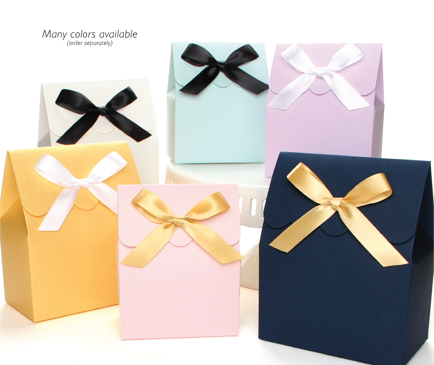 A group view of Lux party’s favor boxes showing various colors and sizes.