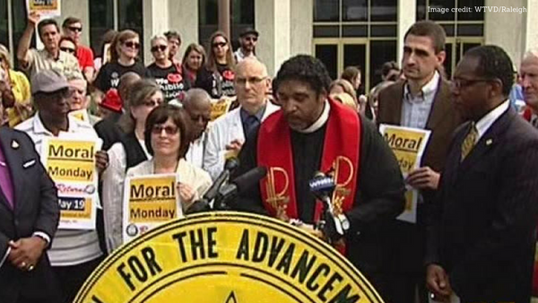 Rev. Barber addresses state legislators at a Moral Mondays protest in 2013