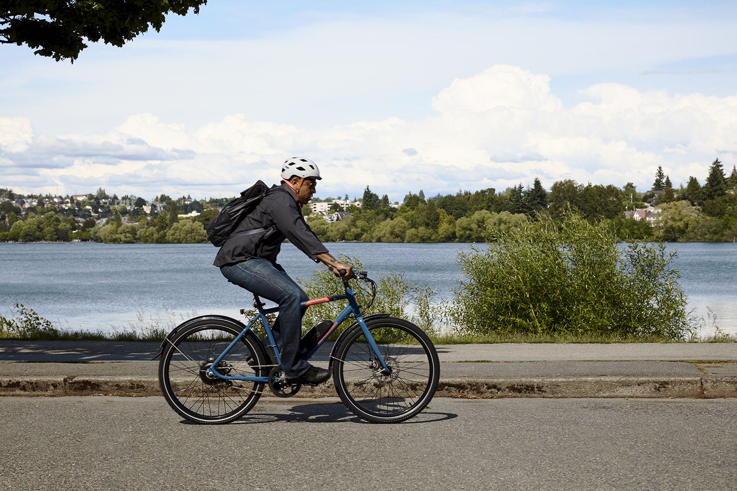 A man rides a RadMission along the waterfront.