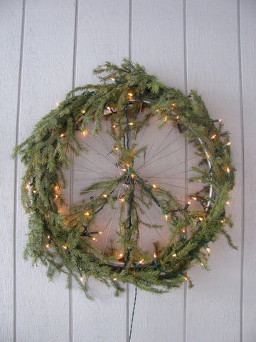 Make a christmas wreath using an old bike wheel.
