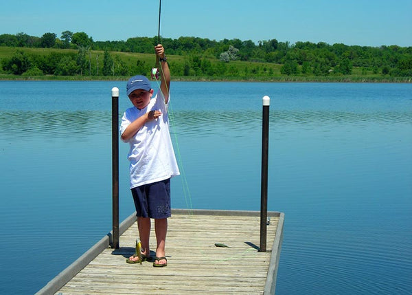 Kid fly fishing bluegill