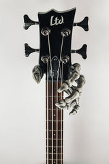 skeleton hand guitar hook holding ltd bass guitar.