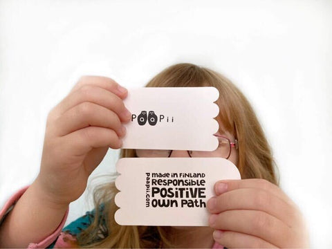 Paapii Clothing Tags held in child's hands