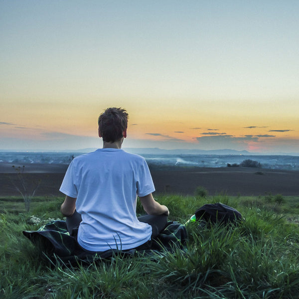 Man meditating outdoors