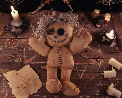Voodoo doll with candles