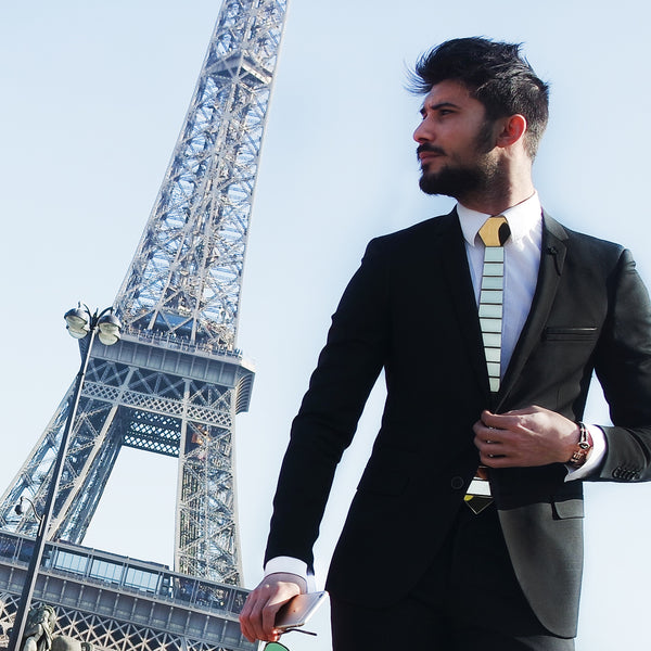 gold tie black suit white shirt