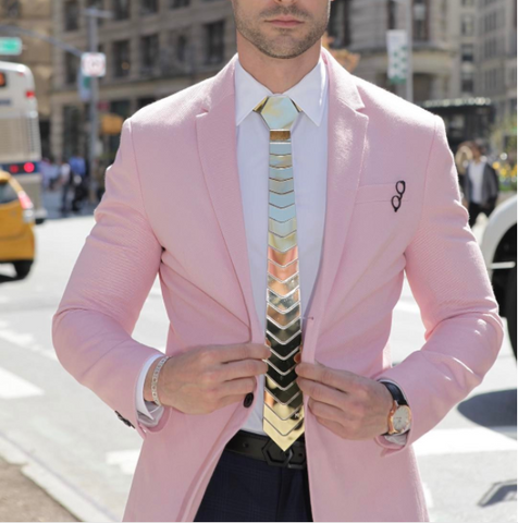 Pink suit with gold tie