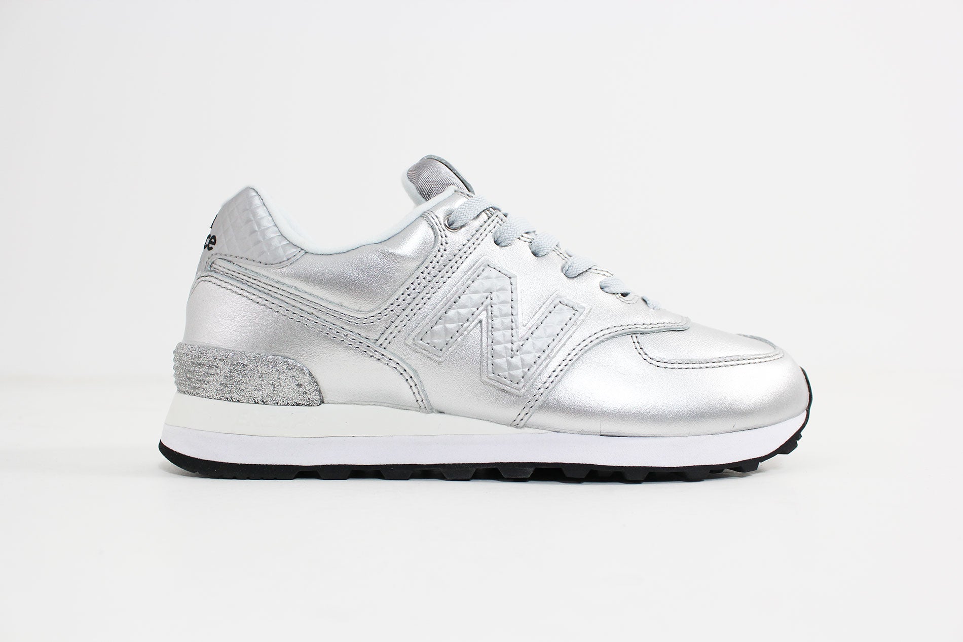 silver new balance sneakers