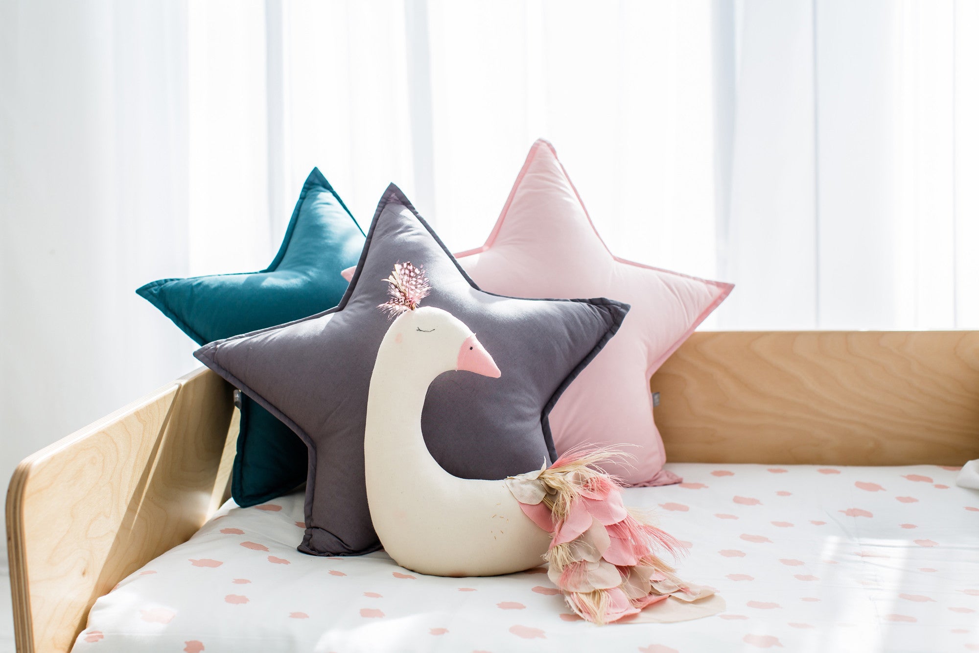 Star cushions and peacock decoration, available at Bobby Rabbit.