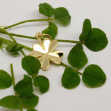 Gold four leaf clover charm