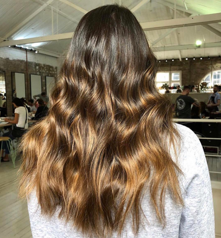 dark to light brown balayage with halo hair extensions