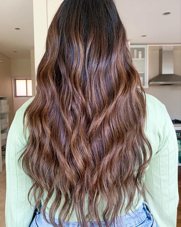 women donning The Thick Halo hair extension in Col. #2/4 Dark Brown + Medium Brown
