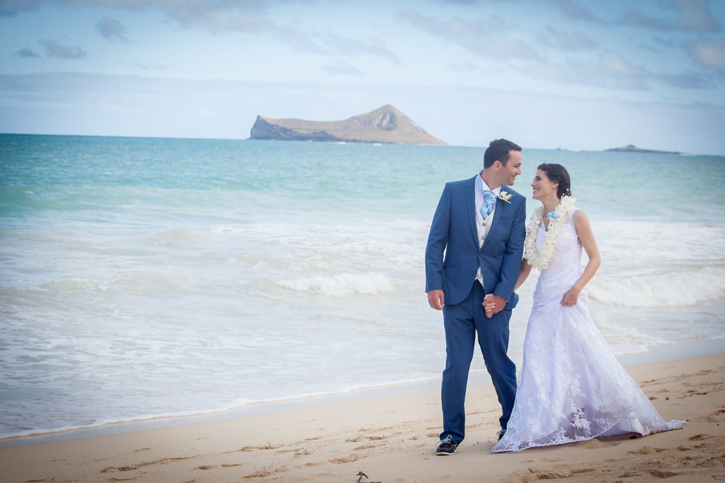 Bride and Groom walk on Waimanalo Beach, Oahu