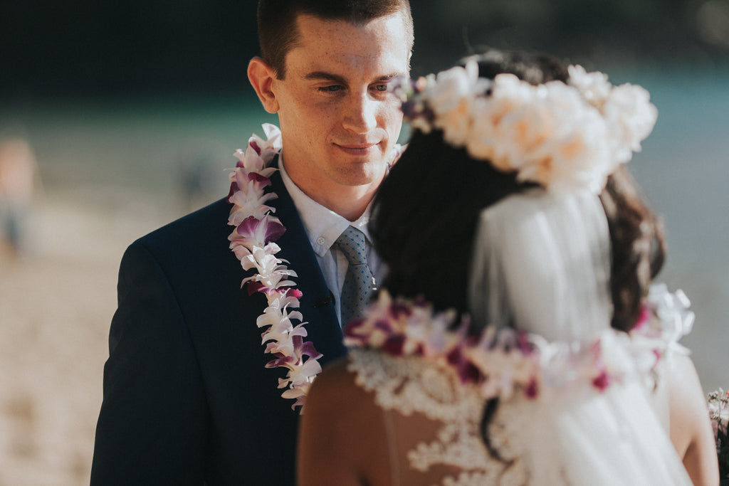 Groom looks at his Bride during Wedding at Ke'e Beach in Kauai
