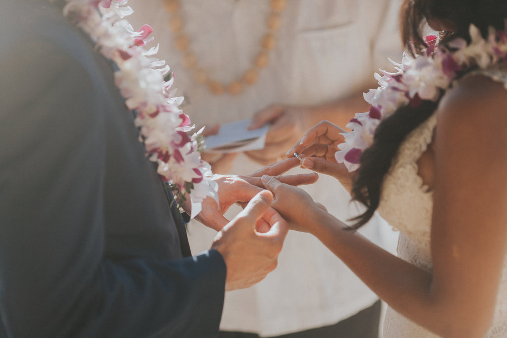 Exchange of Rings as Bride and Groom Marry at Ke'e Beach in Kauai