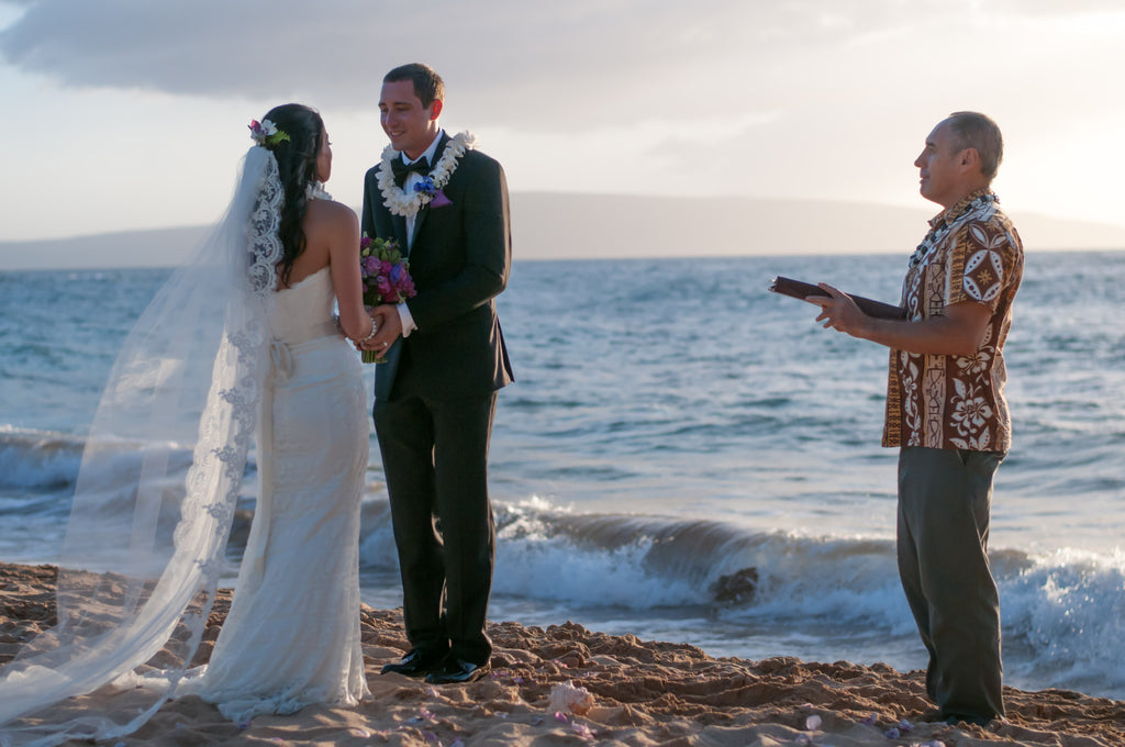 Rev. Carrll Robilotta marries a couple on the beach in Maui