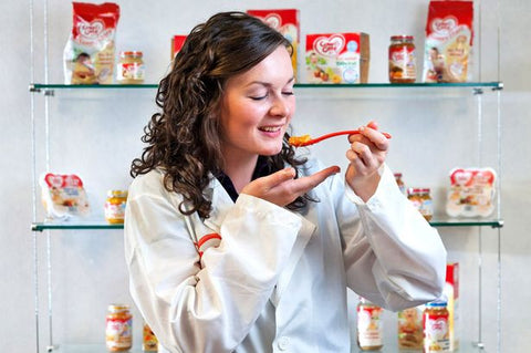 Woman eating baby food