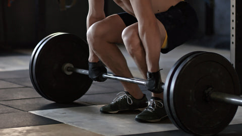 man preparing to lift weights