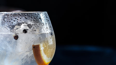 glass of water with a lemon wedge