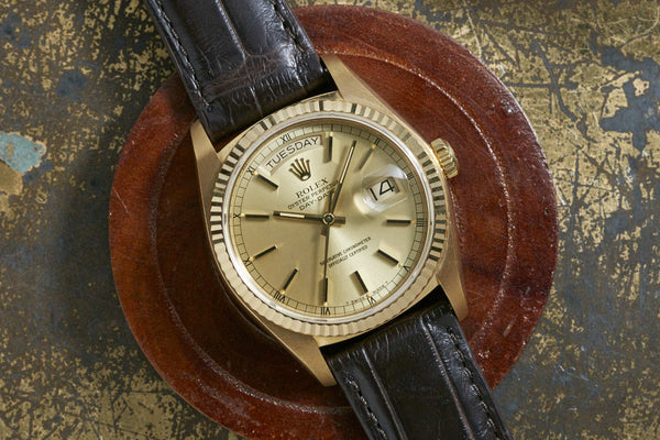 gold rolex day date leather strap