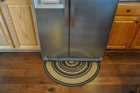 Half circle rug in front of refridgerator