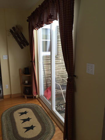 Kette grove rug and burgundy check curtains