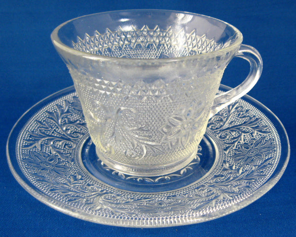 clear glass tea cups and saucers