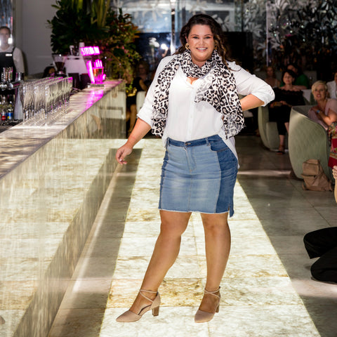Stacey our size 16 model with long brown hair walking the catwalk in our beth skirt and cate shirt 