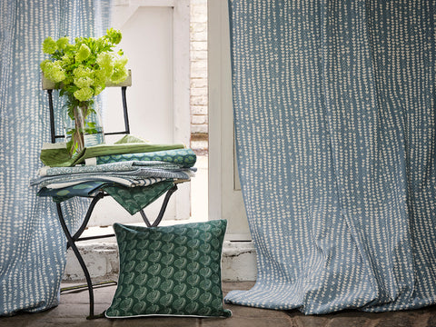 Hopi Fabric inChambray Blue made into curtains with Apple Tree Cushion in Moss Green