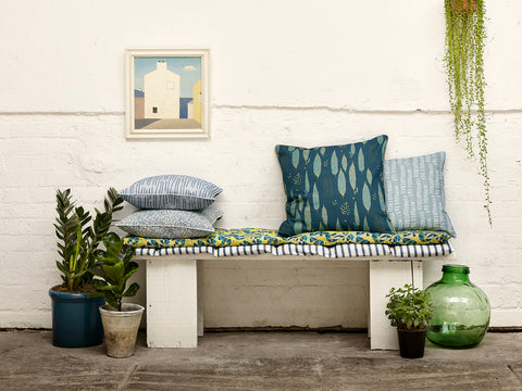 Cushions in Chambray and Petrol Blue on seat covers made from Autumn Stripe in Petrol Blue and Eden Floral in Chartreuse Yellow