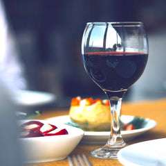 red wine glass with tapas