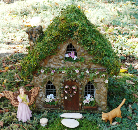 Fairies by a Fairy House in the Fairy Garden